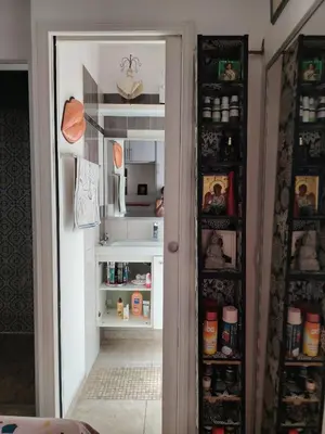 an open refrigerator with its door open to a pantry at Un jardin en Ville in Nice