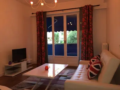 a living room with a couch and a window at Nice Halevy in Nice