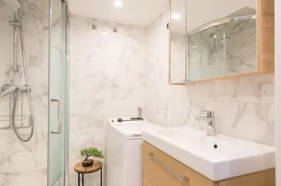 a white bathroom with a sink and a shower at - - Superbe Studio avec Balcon - Nice Centre - - in Nice