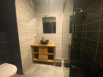a bathroom with a sink and a toilet at Cros de Cagnes Pins Sud Évasion in Cros-de-Cagnes