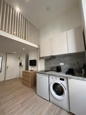 a kitchen with a washing machine in a kitchen at Studio Roma - Jean Médecin - LA RIVIERA LCD in Nice