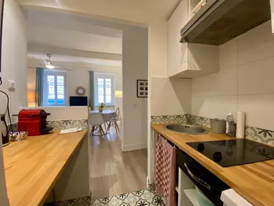 a kitchen with a sink and a counter top at Joli appartement niçois en bord de mer in Nice
