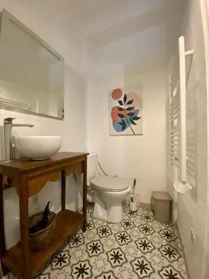 a bathroom with a sink and a toilet at Joli appartement niçois en bord de mer in Nice