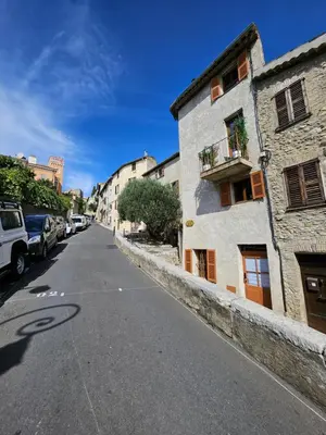 an empty street with cars parked on the side at Atypique studio en bas du Château in Cagnes-sur-Mer