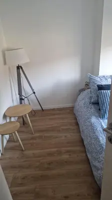 a bedroom with a bed and a table and a chair at Ete Nice in Nice
