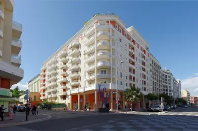 a large white building on the corner of a street at Villa Kappas - B42 Promenade des Anglais in Nice