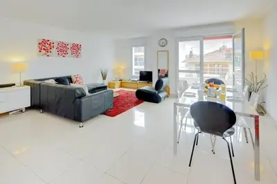 a living room with a couch and a table and chairs at Villa Kappas - B42 Promenade des Anglais in Nice