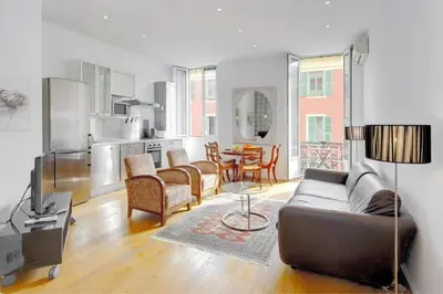 a living room with a couch and a table at Rue Fodere location Port area in Nice