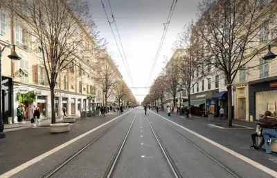 an empty street with streetcar tracks in a city at Studio confortable à Nice - 19 m² avec vue sur la ville in Nice