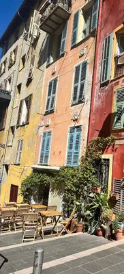 a building with a picnic table in front of it at Vieux Nice in Nice