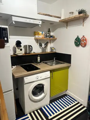 a kitchen with a washing machine and a sink at Vieux Nice in Nice