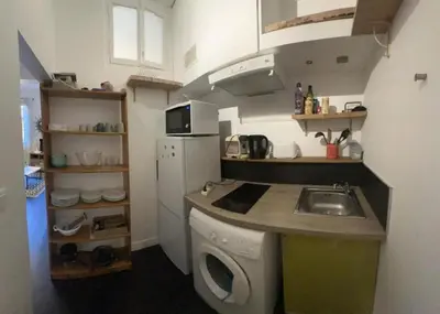 a small kitchen with a sink and a washing machine at Vieux Nice in Nice