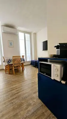 a living room with a kitchen and a dining room at Studio Nice Centre - Climatisation in Nice