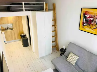 a living room with a couch and a loft bed at Studio Nice Centre 4P Jean médécin avenue in Nice