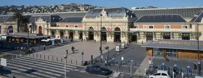 a large building with a parking lot in front of it at Studio Nice Centre 4P Jean médécin avenue in Nice