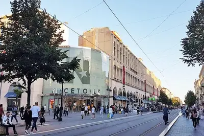 a group of people walking down a city street at Studio Nice Centre 4P Jean médécin avenue in Nice