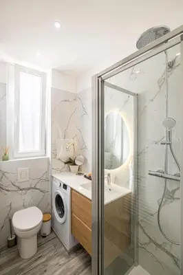a bathroom with a shower and a toilet and a sink at Charming Apt Nice Port Place du Pin with Balcony in Nice