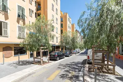 a street with cars parked on the side of the road at 1 GAUTIER 501 - Studio boheme - Quartier du port in Nice