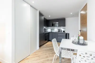 a kitchen and dining room with a table and chairs at 5 FODERE - Magnifique Duplex - Port de Nice - Dernier etage in Nice