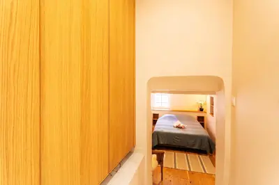 a bedroom with a bed in a small room at COSY VOLTI AP4434 By Riviera Holiday Homes in Villefranche-sur-Mer