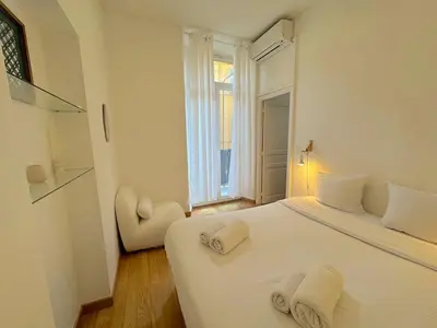 a bedroom with a white bed and a window at ⁂ Appartement cosy avec balcon 300m de la plage in Nice