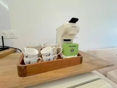 a coffee maker and coffee cups on a wooden tray at ⁂ Magnifique 3P cœur du Vieux Nice in Nice