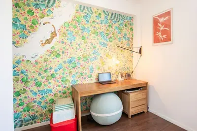 a desk with a laptop on it next to a wall at L58 Port Suite 2 BDRS 5mins Old town & Beach Tram in Nice