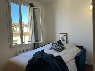 a bed in a room with a window at L58 Port Suite 2 BDRS 5mins Old town & Beach Tram in Nice