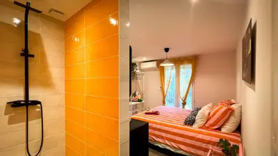 a small room with a bed and a shower at Maison LeFleur in Falicon