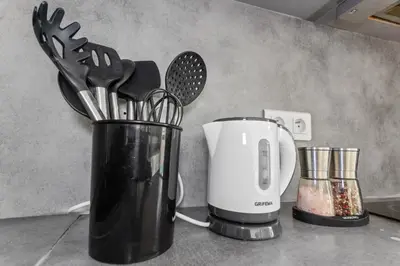 a kitchen counter with a coffee maker and a blender at Le Cosy - Spacious - AC - WIFI - Hippodrome - Racetracks - Hypercentre in Cagnes-sur-Mer