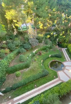 an aerial view of a garden with a pond at Lovely studio apartment in Nice