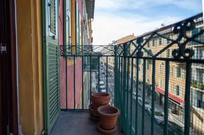 a balcony with pots on the side of a building at GuestReady - Lovely Getaway in Nice