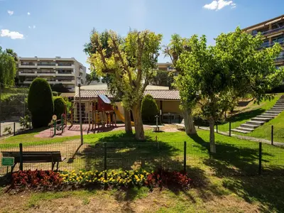 a park with a park bench and a playground at Heliotel Marine Studio 30m2 très lumineux avec terrasse 17m2 au 3eme étage in Saint-Laurent-du-Var