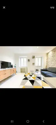 a large living room with a checkered floor at Joli appartement centre de Nice in Nice