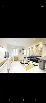 a large room with a kitchen and a living room at Joli appartement centre de Nice in Nice