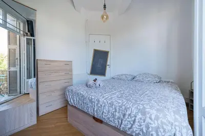 a bedroom with a bed and a dresser and a window at Lovely 2 bedroom Apartment in Nice with Balcony in Nice