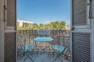 a patio with a table and chairs on a balcony at Lovely 2 bedroom Apartment in Nice with Balcony in Nice