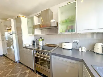 a kitchen with a stainless steel stove top oven at Breathtaking Rooftop Experience on Promenade in Nice