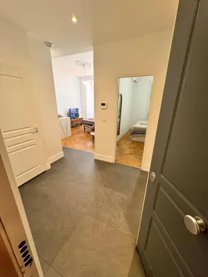 a hallway with a door leading to a living room at Luxury Central Condo with Private Terrace in Nice in Nice