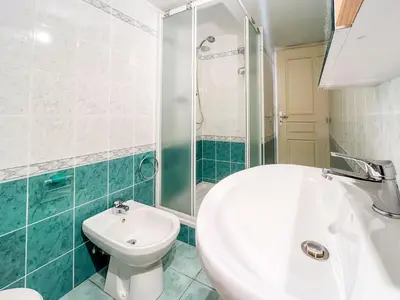 a bathroom with a sink and a toilet and a shower at Barralis Hyper Center 2 Pers AC WiFi in Nice