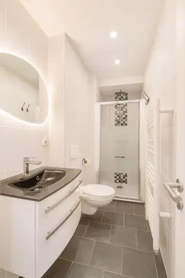 a white bathroom with a sink and a toilet at Cassini 2 Pers Hyper Center WiFi in Nice