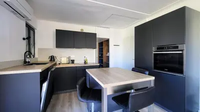 a balcony with a table and chairs on a building at Romantic 1BR Escape with Sun-Rooftop Terrace in Nice