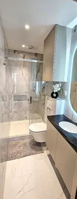 a bathroom with a shower and a toilet and a sink at Studio Nice Plage Luxe in Nice