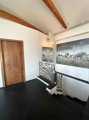 a room with a door and a picture of animals on the wall at MONT BORON - NICE - Splendide villa d'architecte vue panoramique in Nice