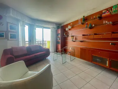 a living room with a couch and a fireplace at La Dolce Vita 6 Pers Parcheggio Terrazza in Nice