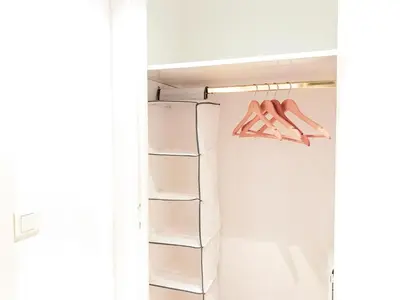 a walk in closet with white shelves at Promenade 2 Pers Vista Mare WiFi AC in Nice