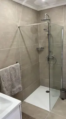a shower with a glass door in a bathroom at Le Félix in Nice