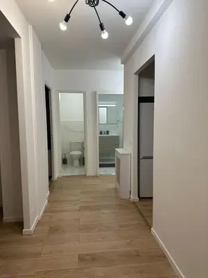 an empty hallway with a toilet in a white room at 2 Bedroom Ocean view Apartment in Nice