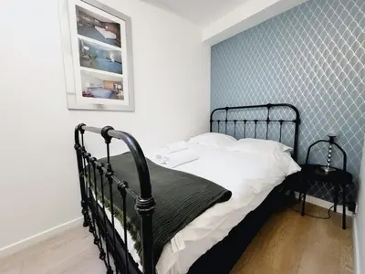 a bedroom with a desk and a bed and a chair at Enjoy old town side Nice-Modern apt-loft with AC in Nice