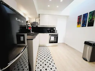 a living room with two chairs and a rug at Enjoy old town side Nice-Modern apt-loft with AC in Nice